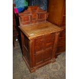 An unusual Pine Cabinet having a four panelled door and an up-stand comprising two small shelves,