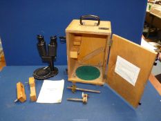 A Russian Binocular Microscope AM-51-2 with attachments and handbook in case
