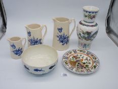 A small quantity of china including graduated jugs, plates and bowls and a Chinese vase.