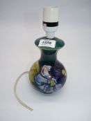 An unsigned or marked Moorcroft 'Clematis' lamp base, 9 1/2" tall.