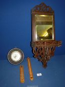 A Mahogany framed wall mirror with shelf and fretwork detail underneath,