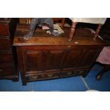 A four panel peg-joyned Oak Coffer having a pair of drawers to the base with shaped backplate drop