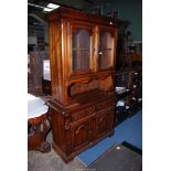 A dark stained wood Dresser,