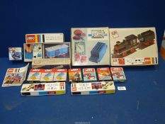 A quantity of boxed Lego trainset including locomotive, rolling stock, components, etc.