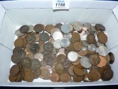 A box of copper and silver coins, pre-decimal and decimal.