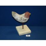 A vintage French folk art wood carving of a cockerel on a stand.