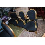 A gilded framed three piece Salon Suite unusually upholstered in black fabric and comprising a pair