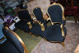 A gilded framed three piece Salon Suite unusually upholstered in black fabric and comprising a pair