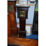 A dark Oak cased longcase Clock, striking the hours on a bell, having cross-banded details,