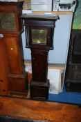 A dark Oak cased longcase Clock, striking the hours on a bell, having cross-banded details,