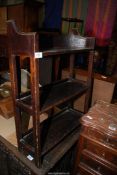 A heavy Oak three stage floor standing Bookshelves, the upstand with a fretworked spade motif,