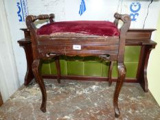 A Mahogany Piano Stool standing on cabriole legs,