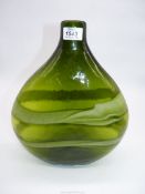 A large vintage bulbous bottle vase in shades of green.