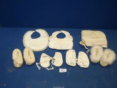 A collection of very old baby boots, etc to include; two wool booties from 1926,