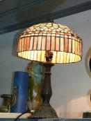 A Tiffany style Lamp in brown and cream design. 23" tall.