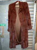 A ladies vintage fur coat by Bradleys, size M.