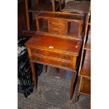 A compact Mahogany Writing Desk having two drawers, a flap-over part inset leather writing surface,