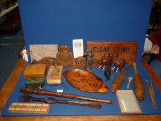 A box of treen including elephant, batons, Salvation Army sign, etc.