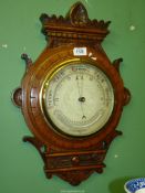 A Barometer with carved surround, 20 1/2'' high.