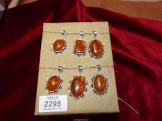 Six amber 925 pendants (new).