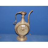 An elaborately engraved Persian ewer, (repair to spout), 15" tall.