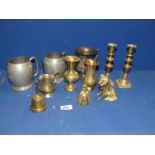 A quantity of brass and metals to include; candlesticks, bells, dogs, etc and two pewter tankards.