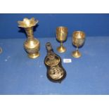 A quantity of horse brasses including Nelson & Victory, plus a jug and two goblets.