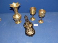A quantity of horse brasses including Nelson & Victory, plus a jug and two goblets.