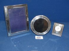 Two silver photograph frames; one circular stamped 925 Birmingham maker A.