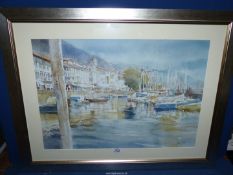 A framed and mounted Print depicting a Continental harbour scene, signed lower right Xavier F.