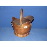 A Copper coal bucket.