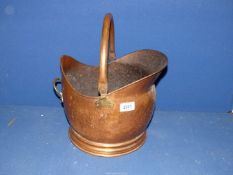 A Copper coal bucket.