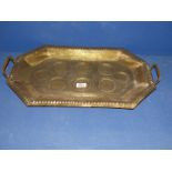 An Indian embossed brass drinks Tray decorated with animals and foliate design.