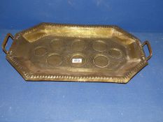 An Indian embossed brass drinks Tray decorated with animals and foliate design.