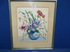 A framed and mounted German coloured Woodcut of Spring flowers in a jug.
