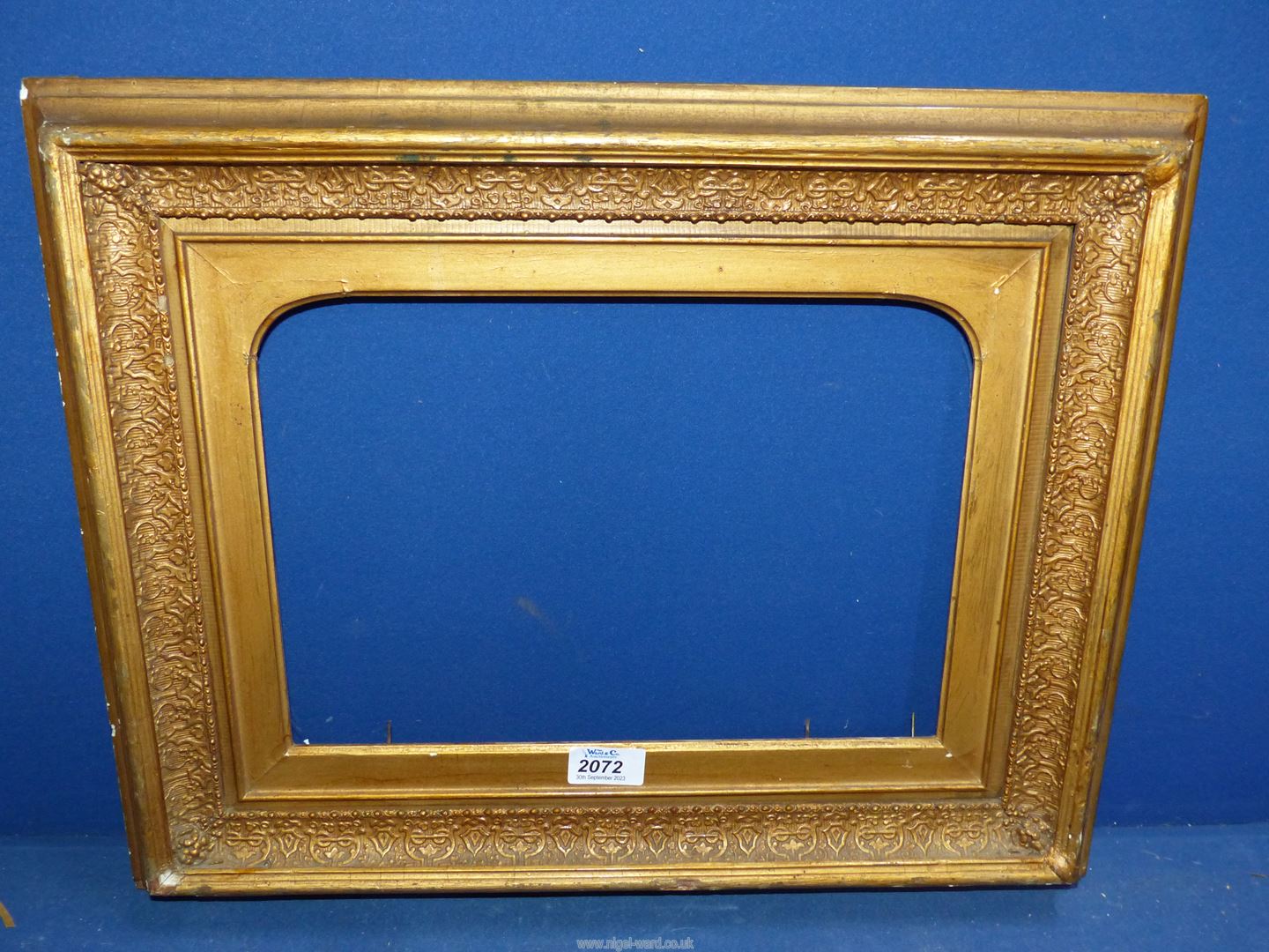 A Victorian wood and gesso picture frame.