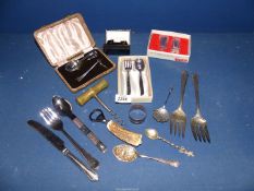 A small quantity of plated and metal items including; berry spoon, Christening set, serving forks,