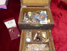 A jewellery box and contents, brooches etc.
