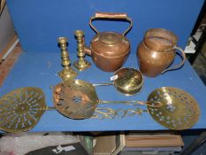 A box of brass candlesticks and trivets, copper jug and kettle, chestnut roaster, etc.