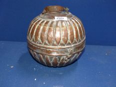 A lovely example of a Middle Eastern spice box of globular form in copper with a worn tinned finish.