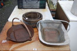 A galvanised Trug, two copper planters and a skillet.