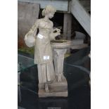 A concrete figure of a women holding two urns pouring into a font - 23½" high.
