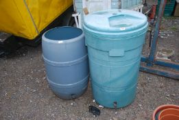 Two plastic water butts with taps.