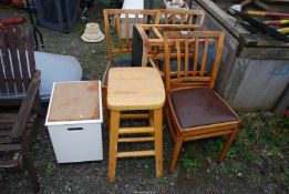 Three kitchen chairs and three stools, plus a bathroom laundry bin.