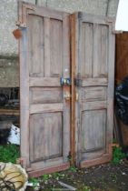 Two solid doors includes locks and keys - 25" x 78".