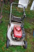 A 'Honda' easy start mower with roller and grass box - good compression.