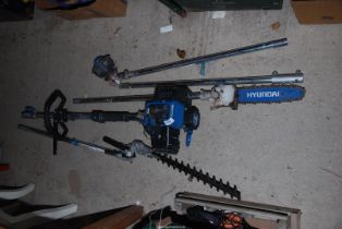 A 'Hyundai' combination hedge trimmer, strimmer and chainsaw - Good compression.