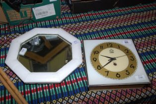 EME wall clock and a small octagonal mirror.