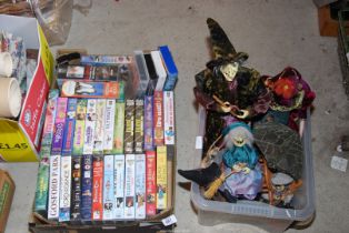 A quantity of Disney videos and a box of Witches.