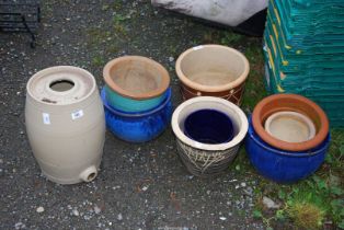A quantity of glazed pots and a sherry barrel.